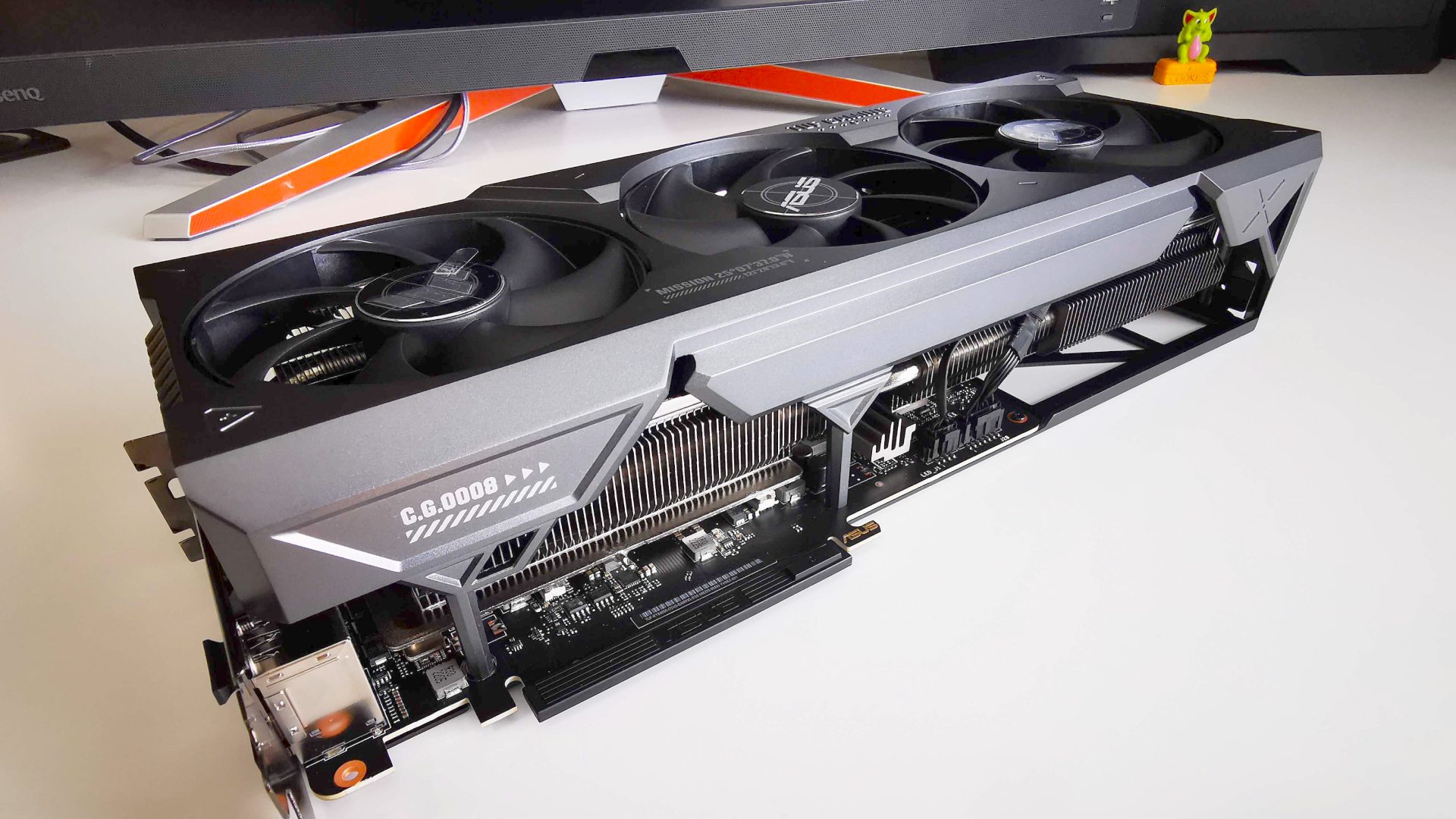 Nvidia RTX 4090 Asus TUF gaming graphics card lying on desk
